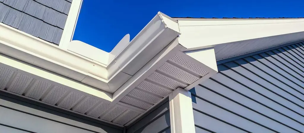White soffit and fascia on a house with blue siding